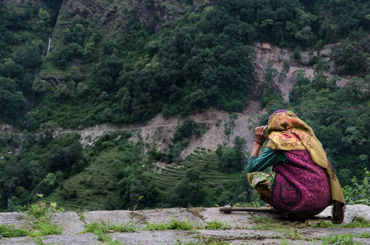 Lady weeding - Best hiking in Nepal