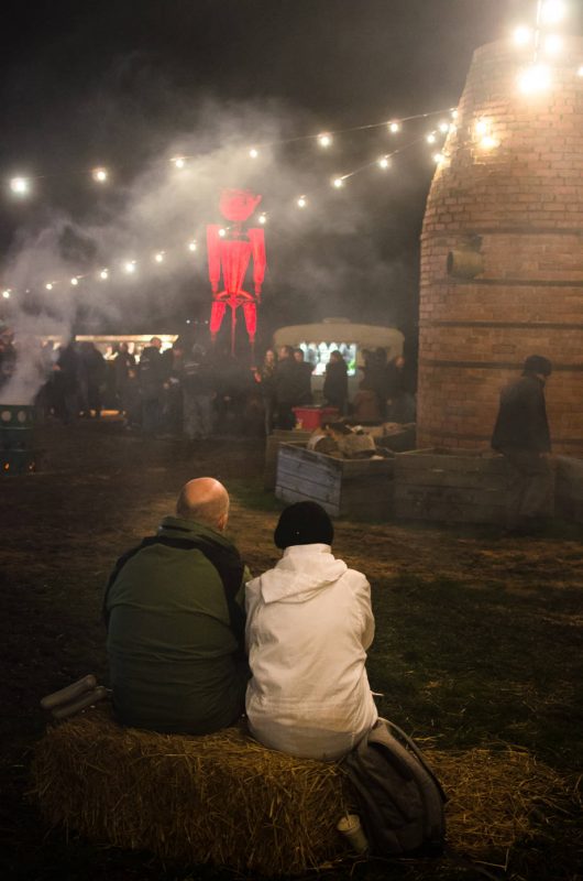 A couple watching big Willie burn - Huon Valley Mid Winter Festival