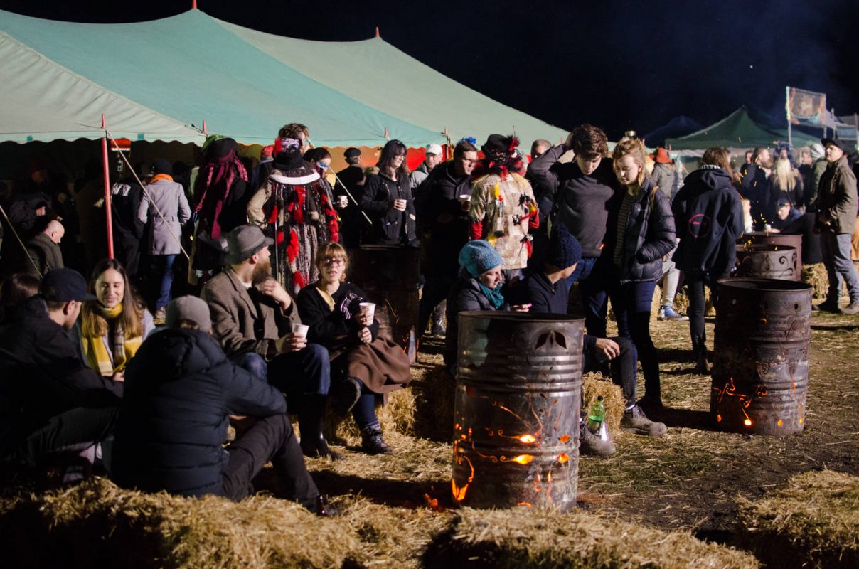 People sitting on hay bales - Huon Valley Mid Winter Festival